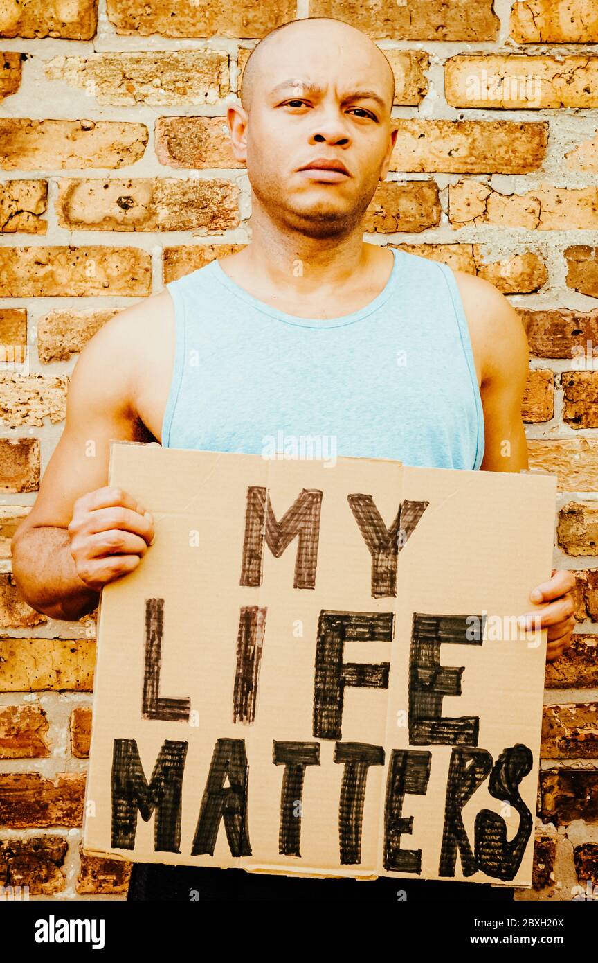 A black man is holding a sign that says 'My life matters' Stock Photo