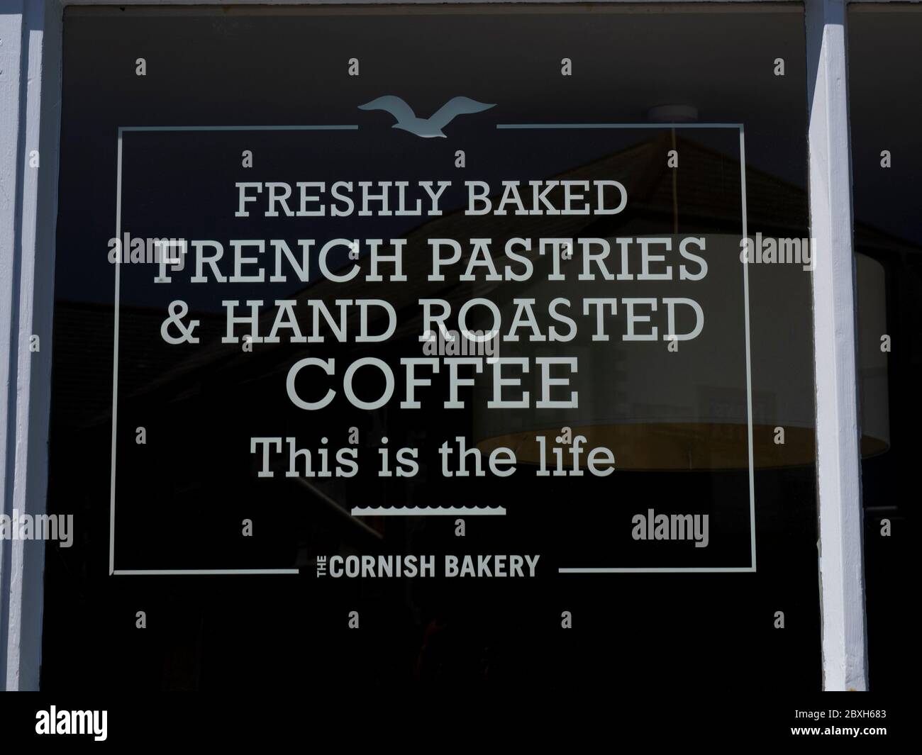 Writing on the door of The Cornish Bakery, Tintagel, Cornwall, UK Stock Photo