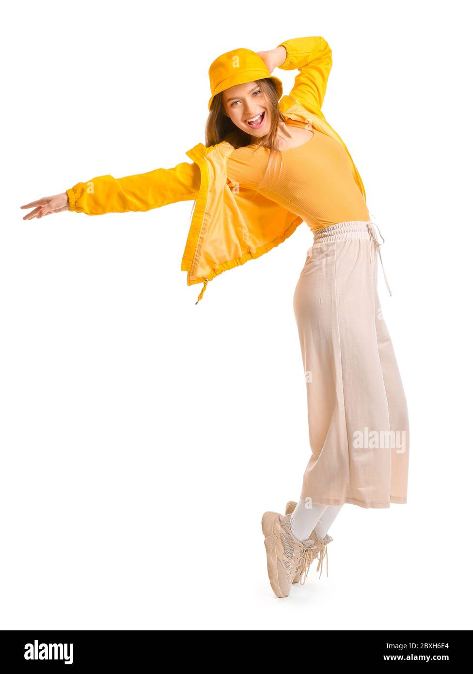 Young female hip-hop dancer on white background Stock Photo - Alamy