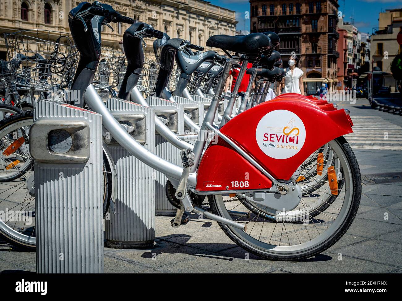 Seville, Spain; June 7, 2020: Selective focus on a parked bicycle of the Sevici bicycles rental service in Seville, Andalusia, Spain, Europe Stock Photo