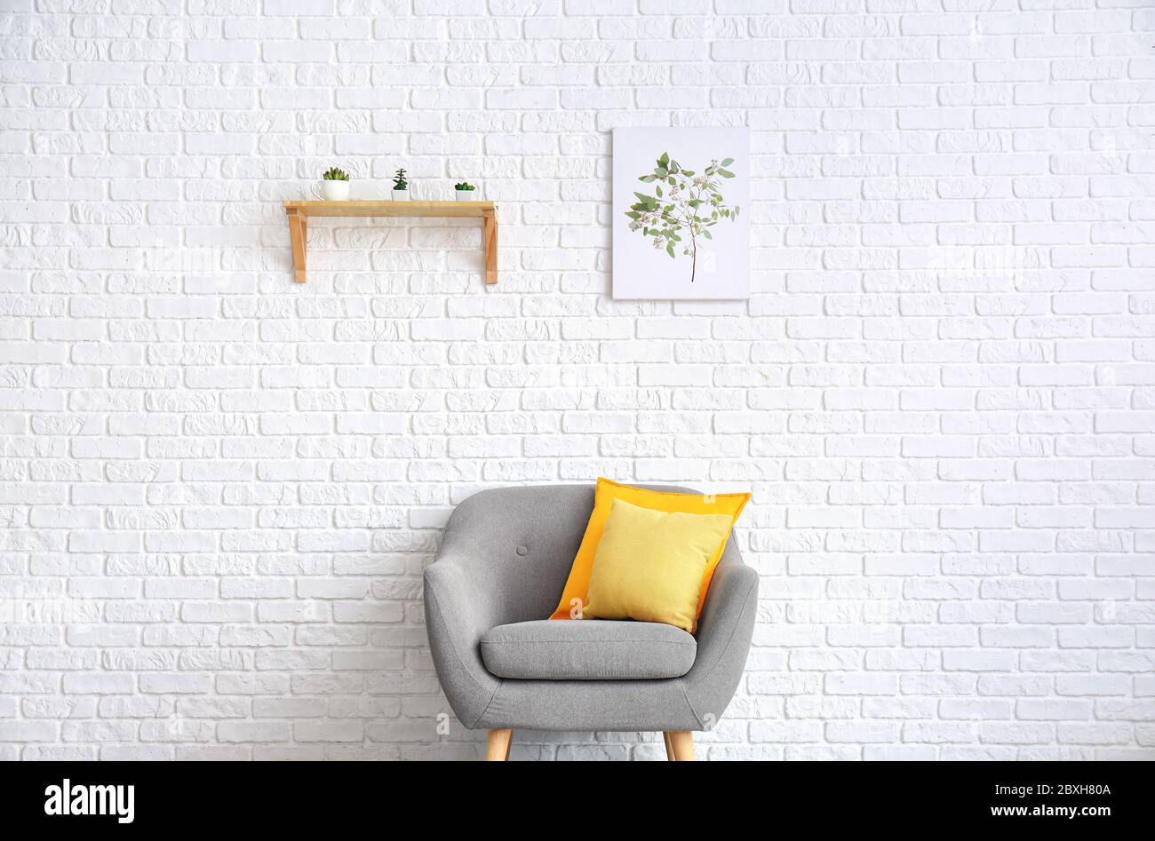 Interior of modern stylish living room with armchair Stock Photo - Alamy