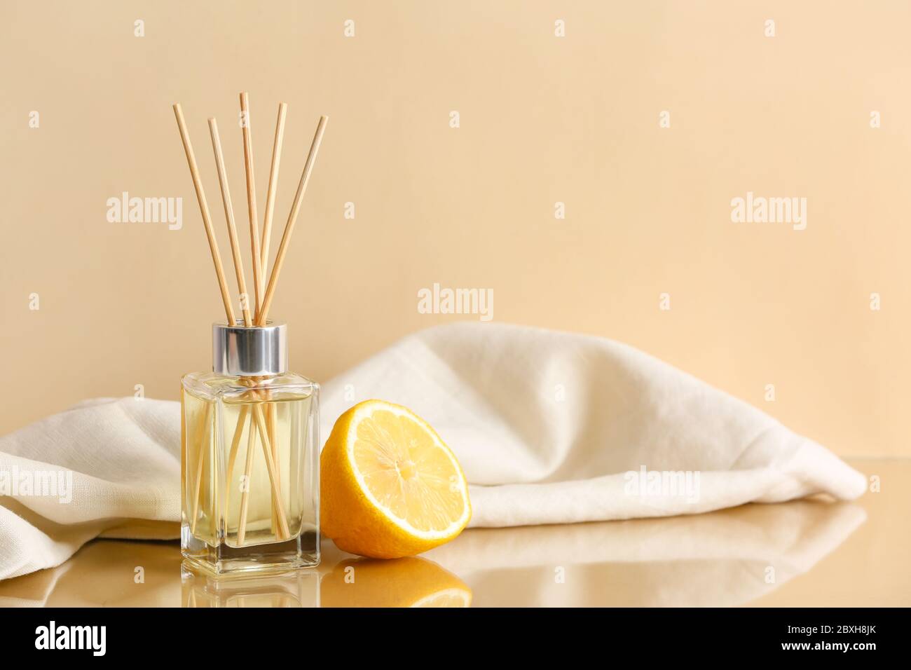 Citrus reed diffuser on table Stock Photo