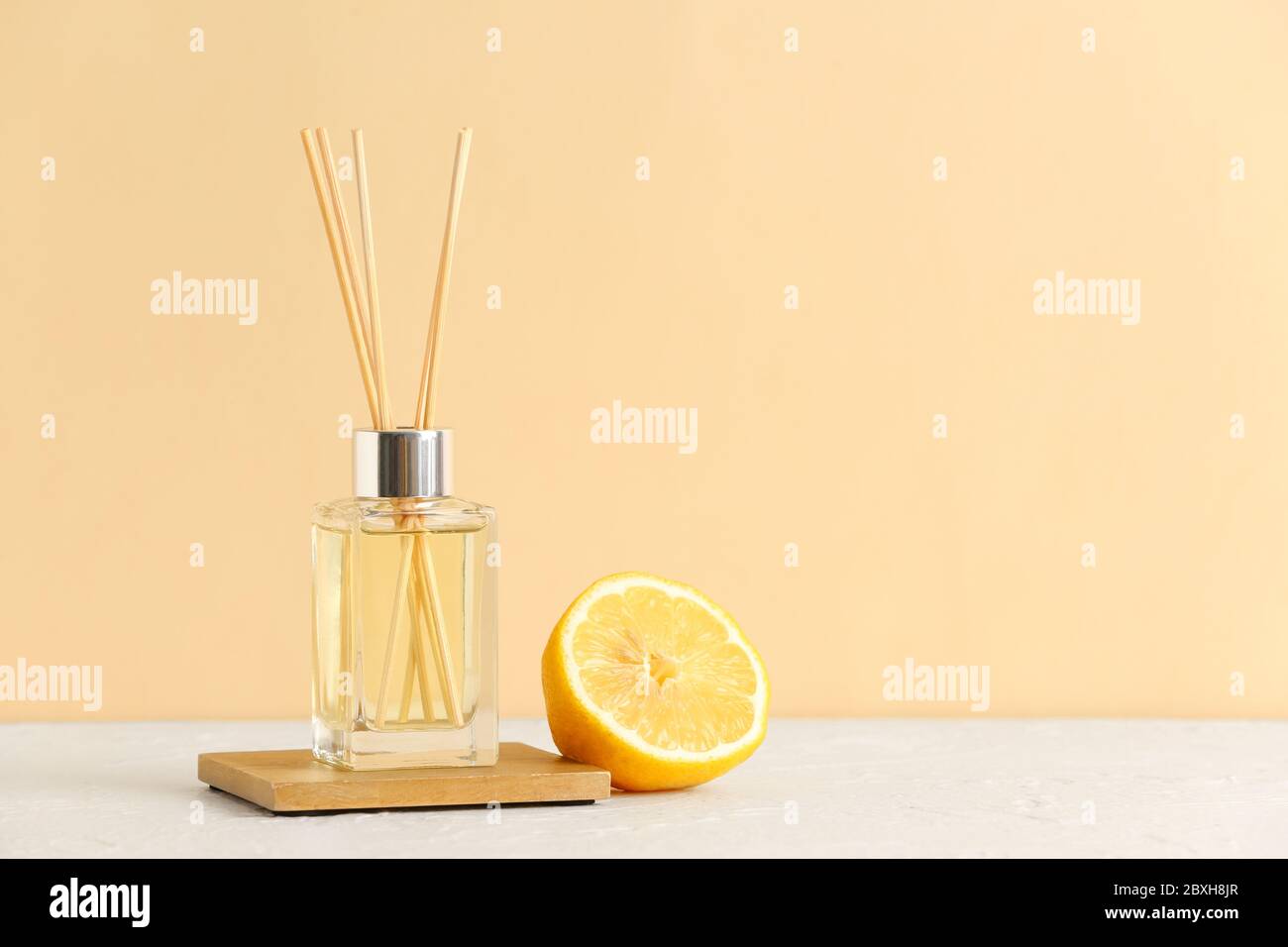 Citrus reed diffuser on table Stock Photo