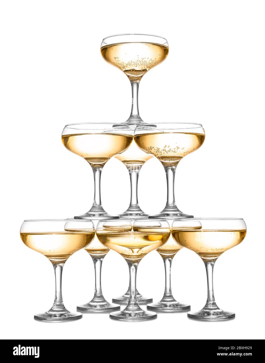 Tower made of glasses with champagne on white background Stock Photo
