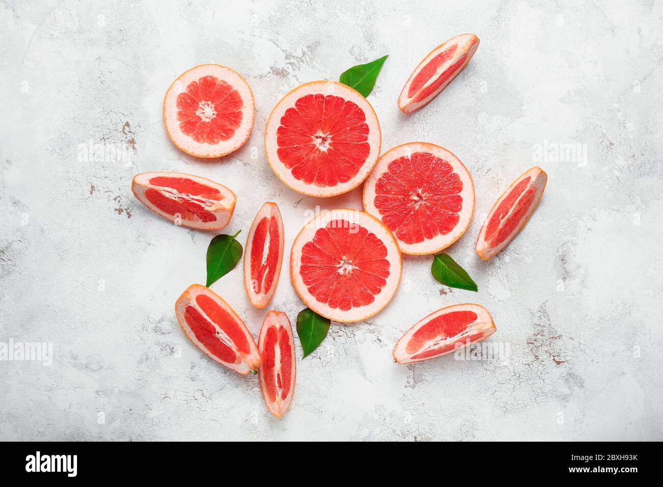 Fresh sliced grapefruit on light background Stock Photo