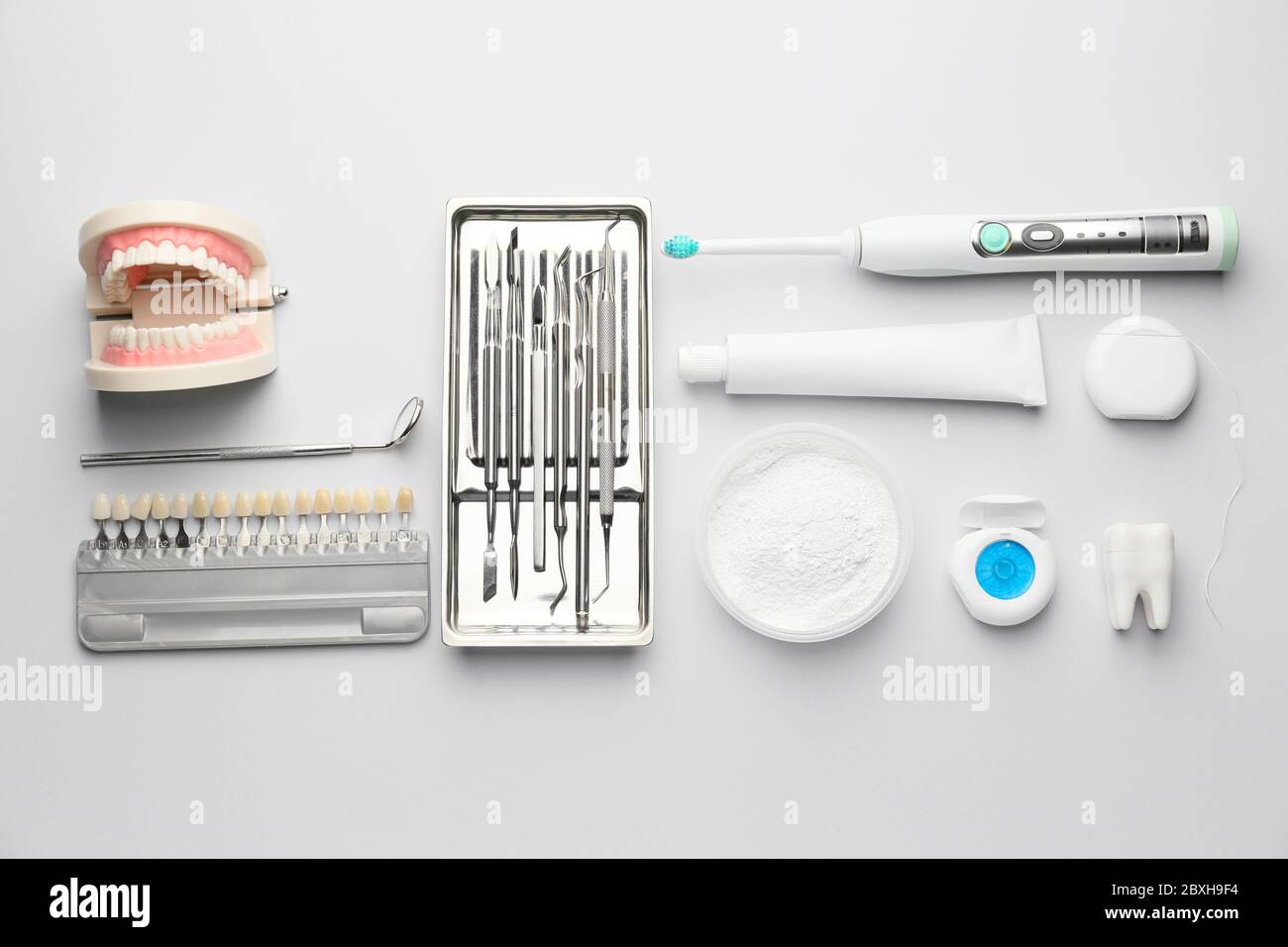 Set for oral hygiene with dental tools and teeth color samples on white ...