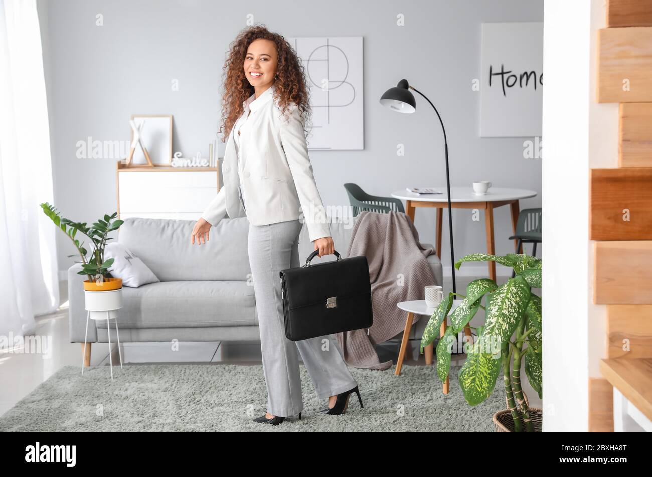 Happy businesswoman before weekends at home Stock Photo