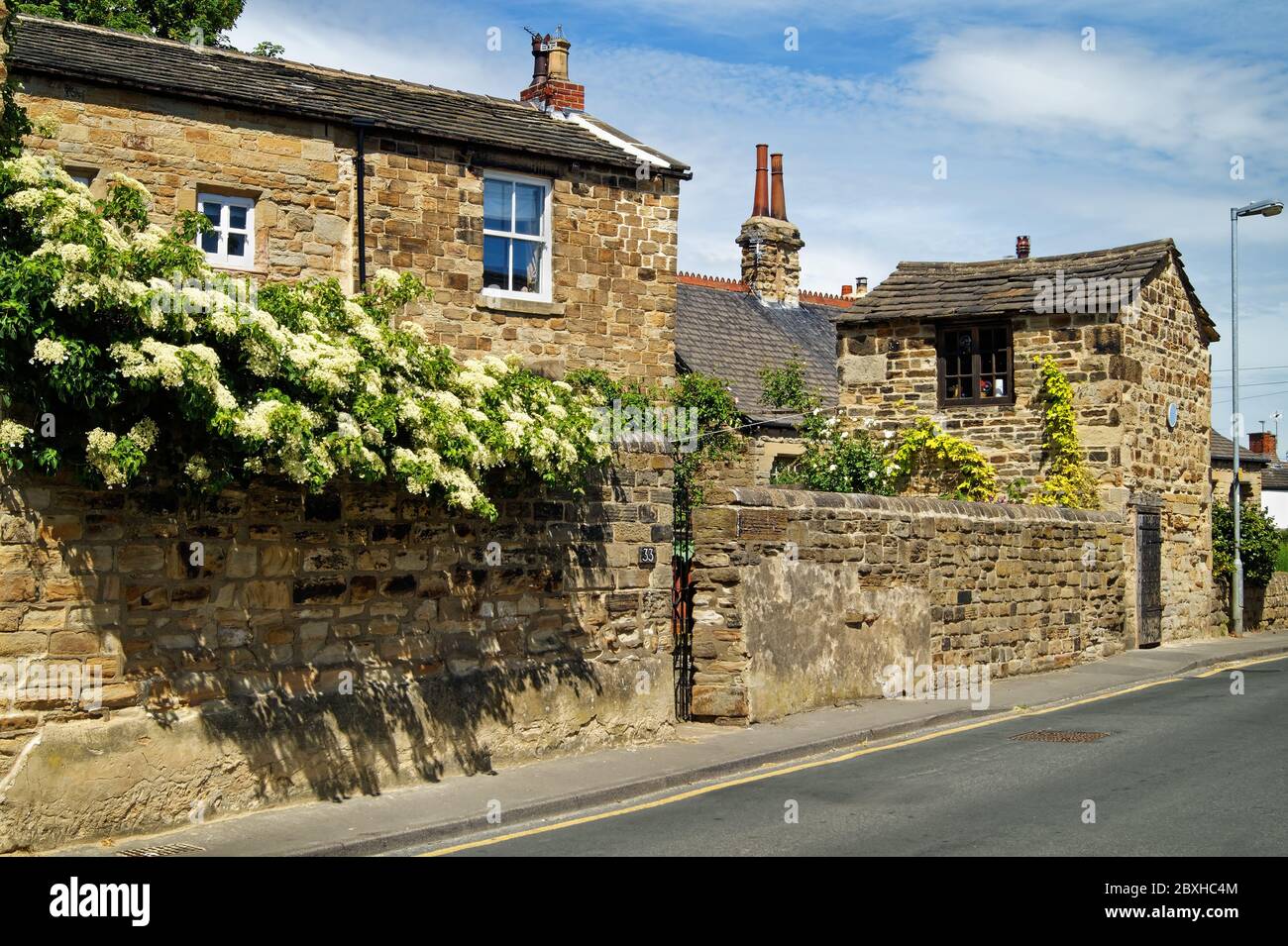 UK,West Yorkshire,Wakefield,Horbury,Tithe Barn Street,Kidcote or Old Lock Up Building and Cottage Stock Photo