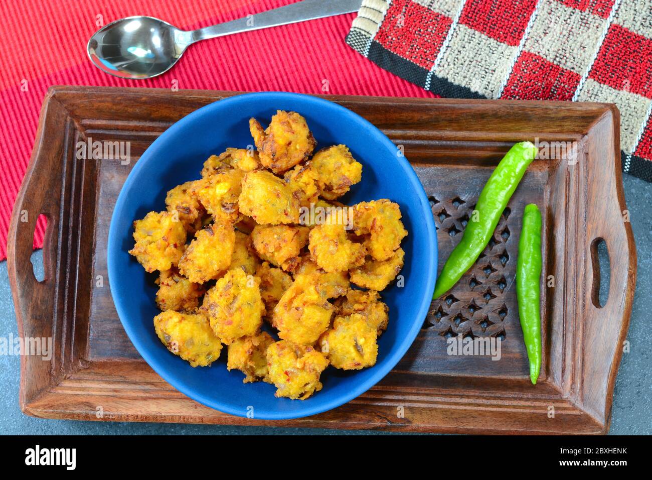 Pakora also called pakoda is a popular indian fried snack and also favorite street side food. Stock Photo