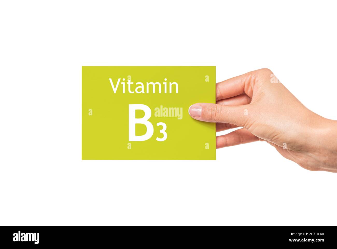 Female hand shows a card with the inscription Vitamin B3. Vitamin B3