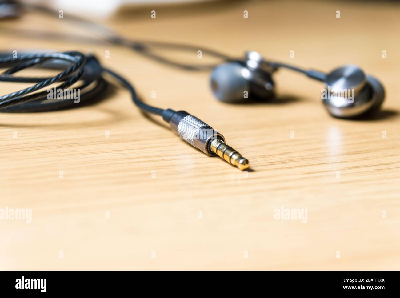 In-ear headphones with 3.5mm mini stereo jack pin Stock Photo