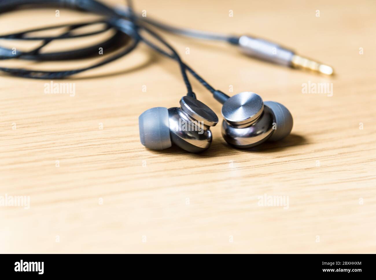 In-ear headphones with 3.5mm mini stereo jack pin Stock Photo