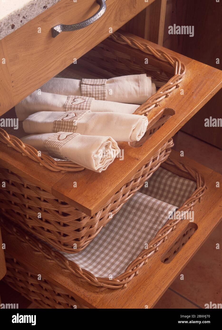 Basket storage for linen, table mats etc Stock Photo Alamy