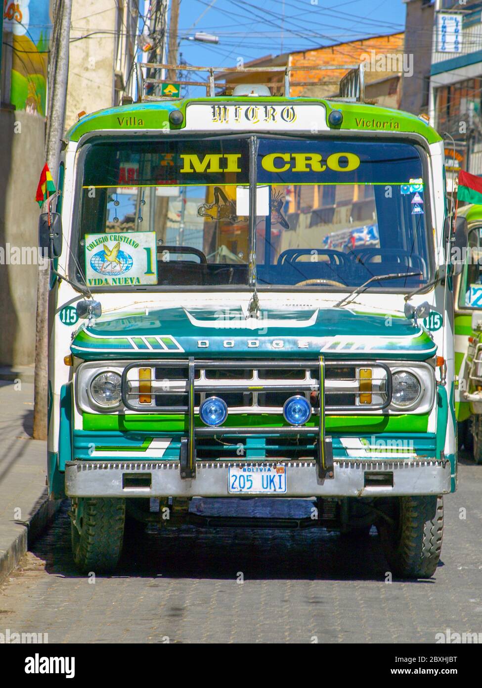 LA PAZ, BOLIVIA - JULY 21, 2008: Front view of old green Dodge micro bus in streets of La Paz, Bolivia. Stock Photo