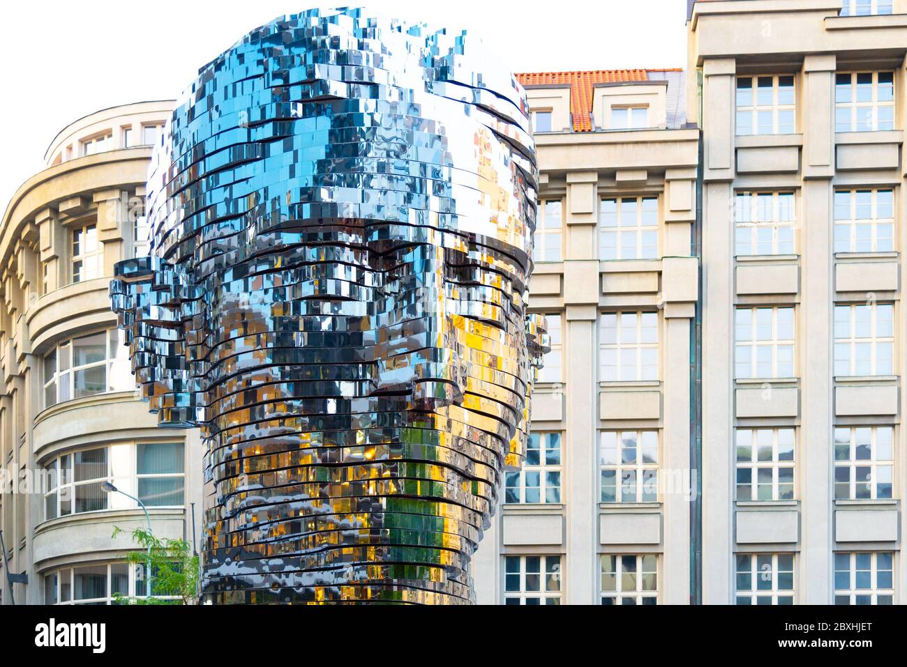 PRAGUE, CZECH REPUBLIC - AUGUST 17, 2018: Statue of Franz Kafka. Glossy metal mechanical sculpture of famous Czech writer. Bust by artist David Cerny. Prague, Czech Republic. Stock Photo