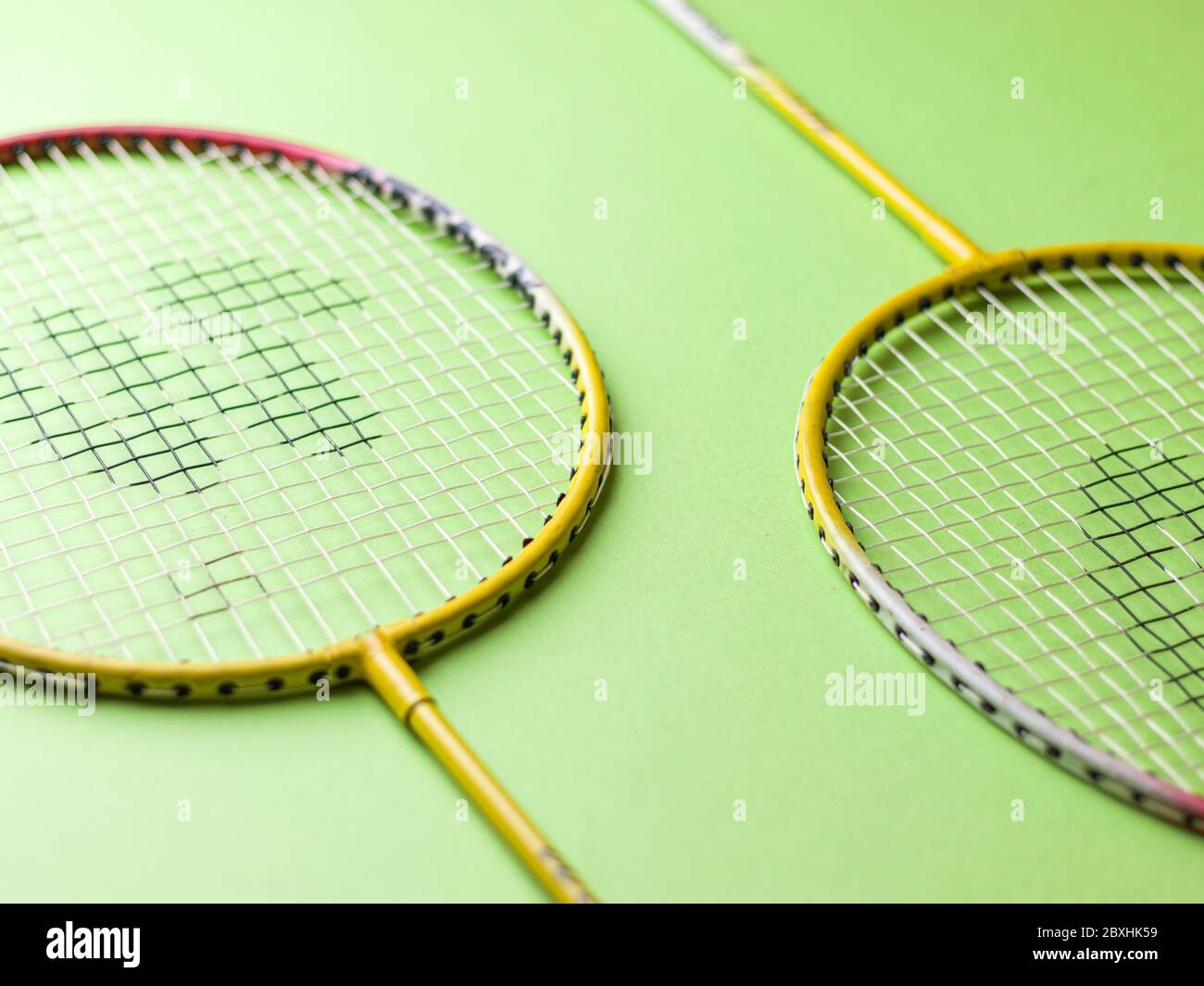 Badminton racket and White Feather Shuttlecock with a colour green ...