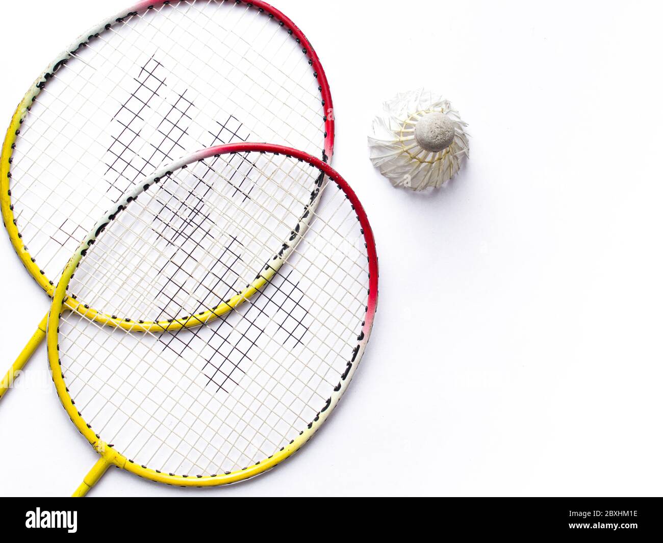 Badminton racket and White Feather Shuttlecock with a colour green ...