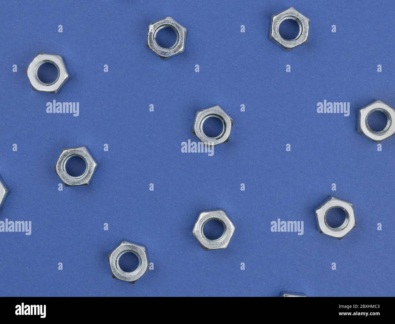 Nuts on blue background close-up. Stock Photo