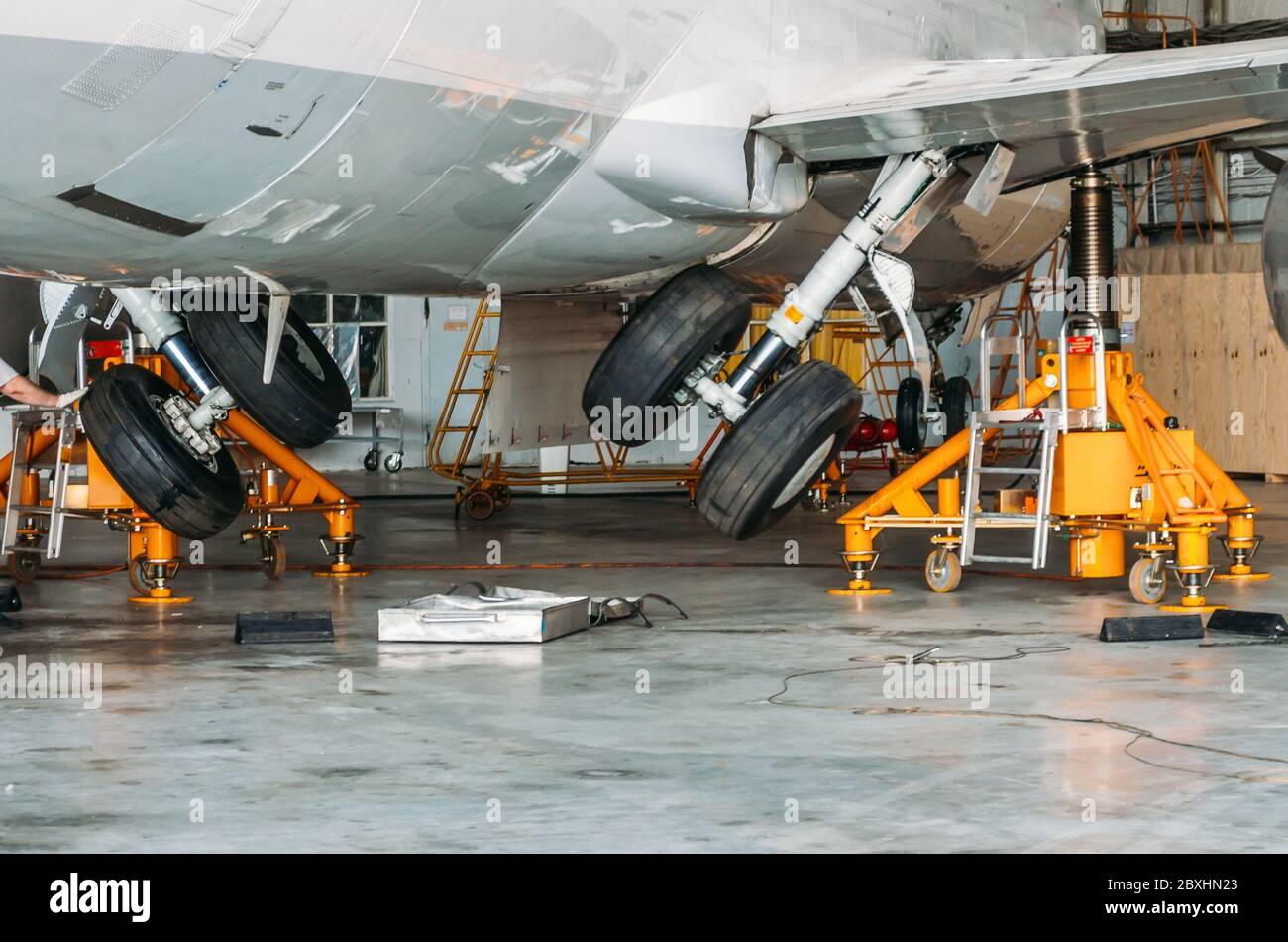 Gear up gear down chassis in the hangar after aircraft repair Stock Photo