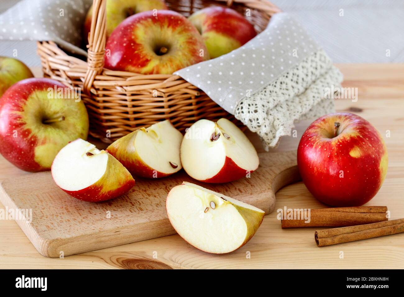 Basket with apples on wooden table, copy space. Stock Photo