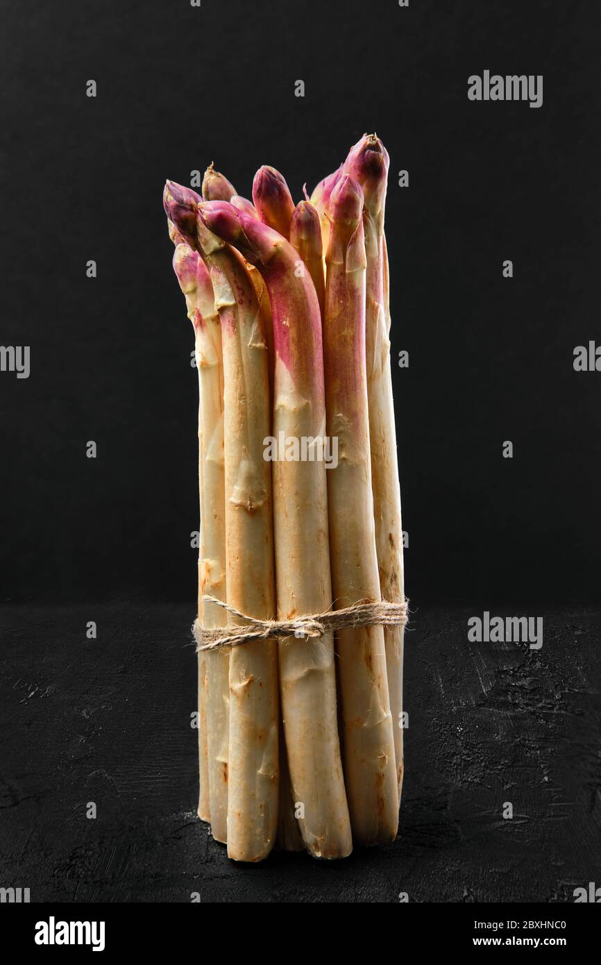 Bunch of asparagus stalks on black background Stock Photo