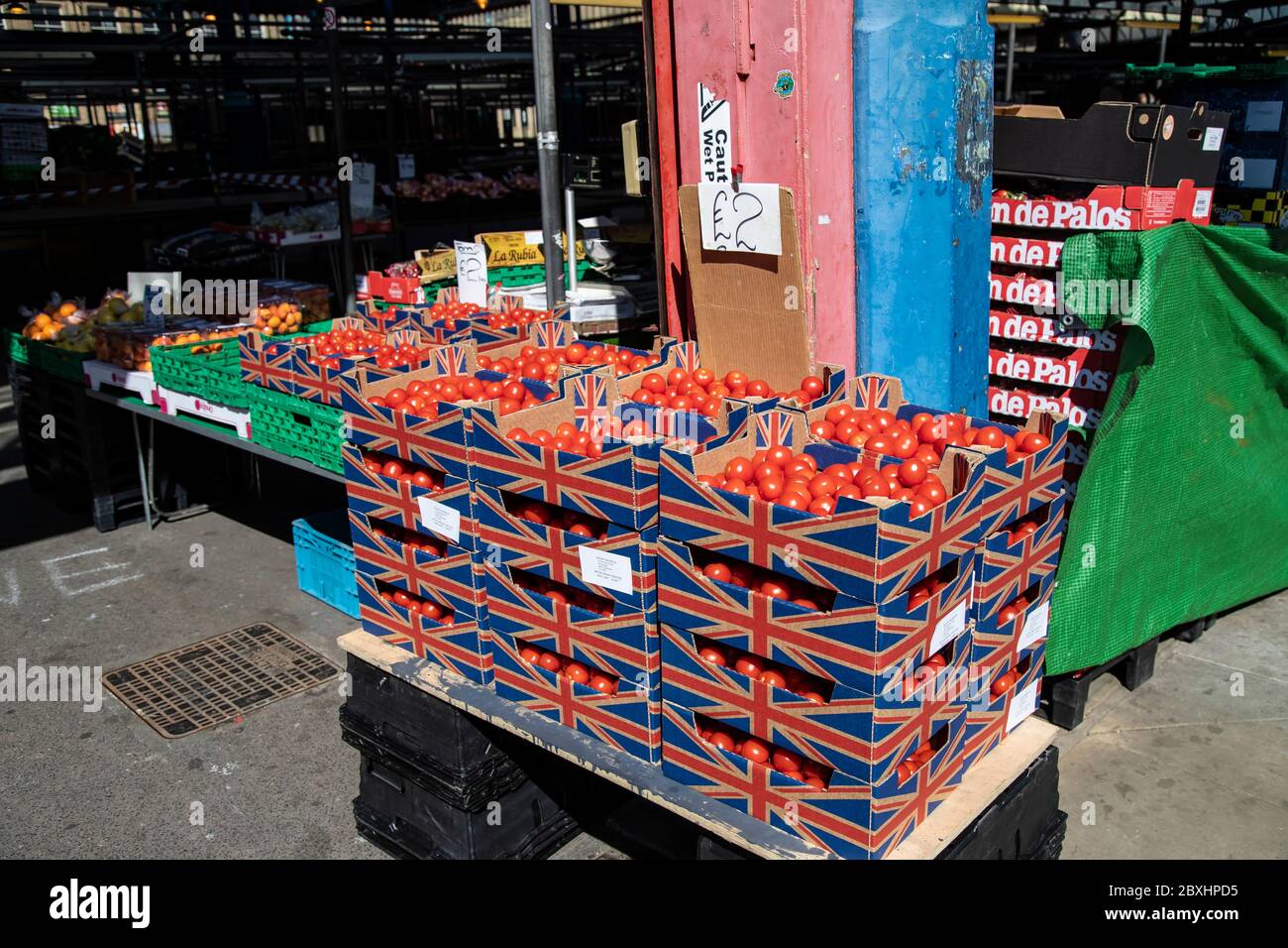 Boxes full of red tomatoes in an open market stall in Huddersfield ...