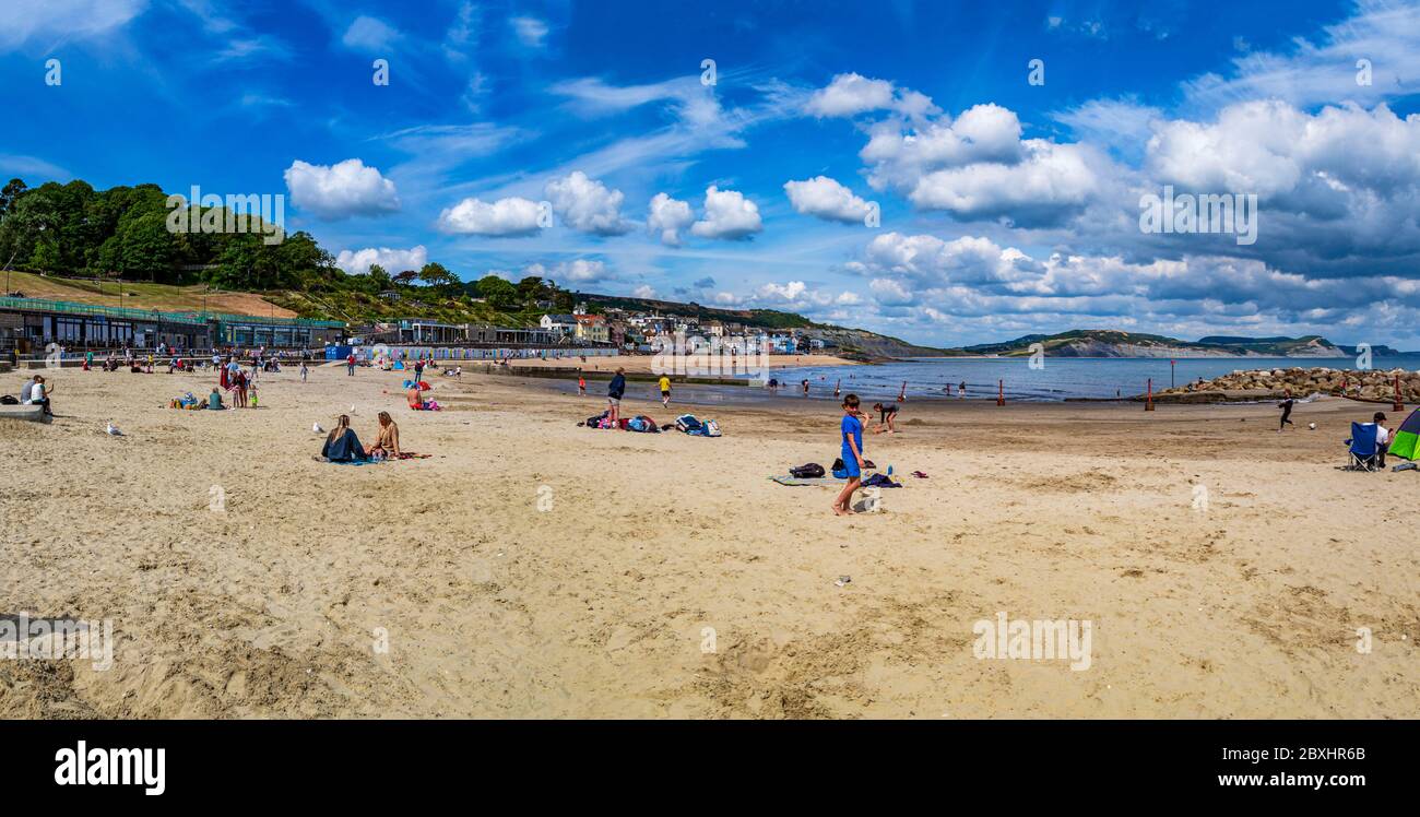 05 June 2020, Lyme Regis, UK. Beachgoers obey the social distancing rules at the seaside in Dorset, England, UK. Photo © Matthew Lofthouse - Freelance Photographer. Stock Photo