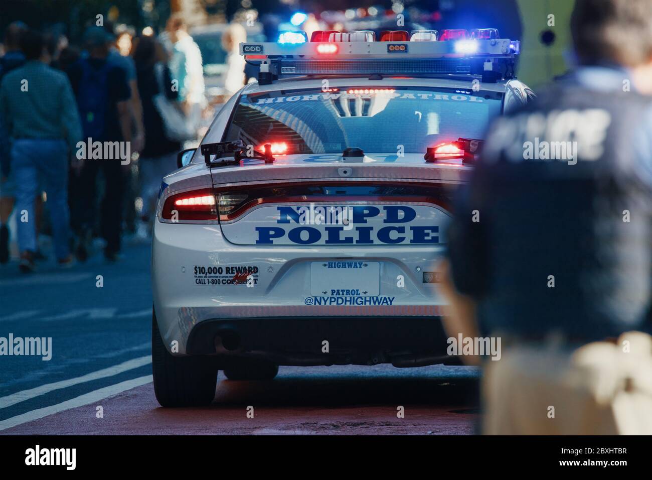 American policeman and police car in the background Stock Photo