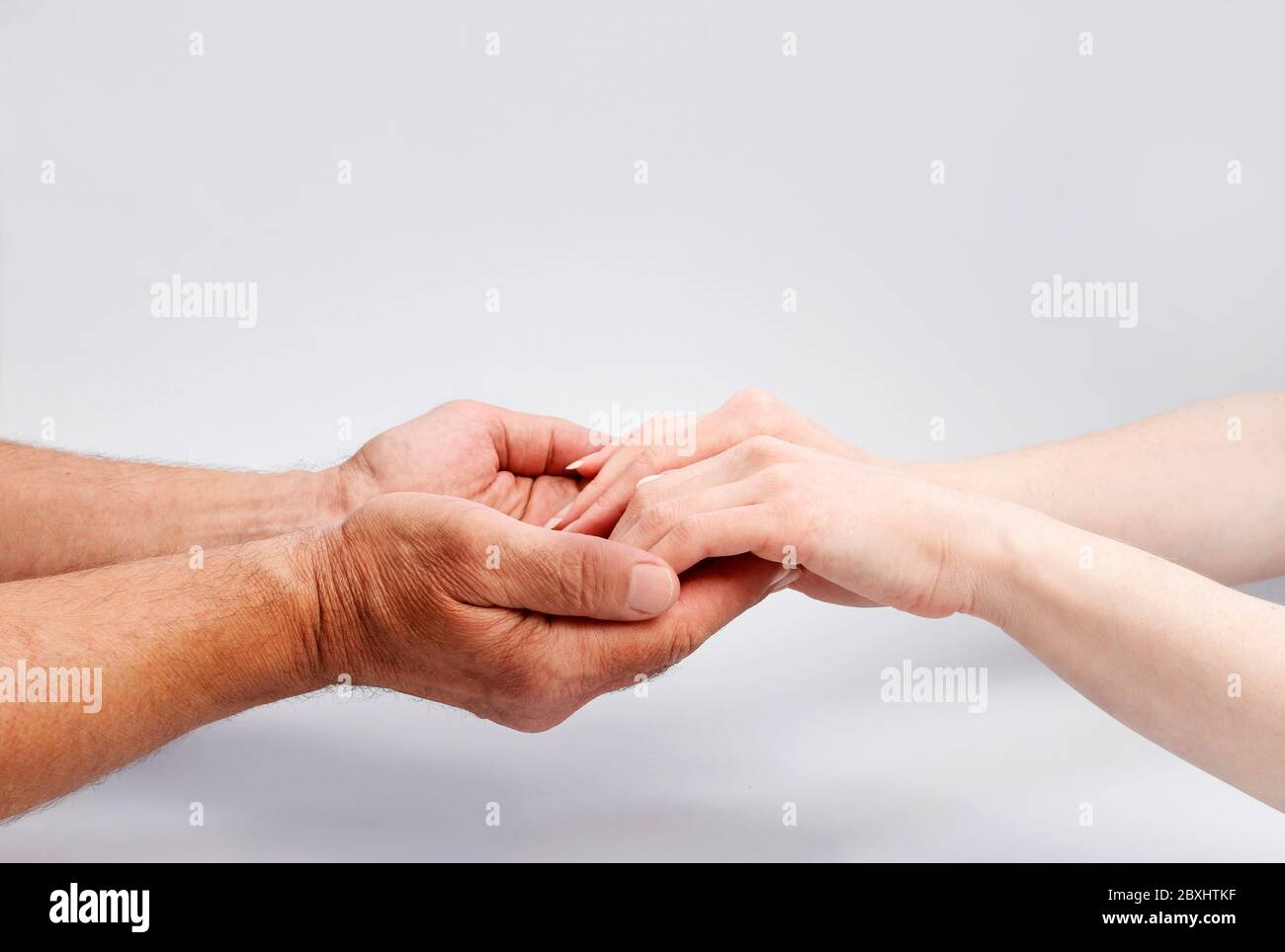 Old woman young man holding hands hi-res stock photography and images ...
