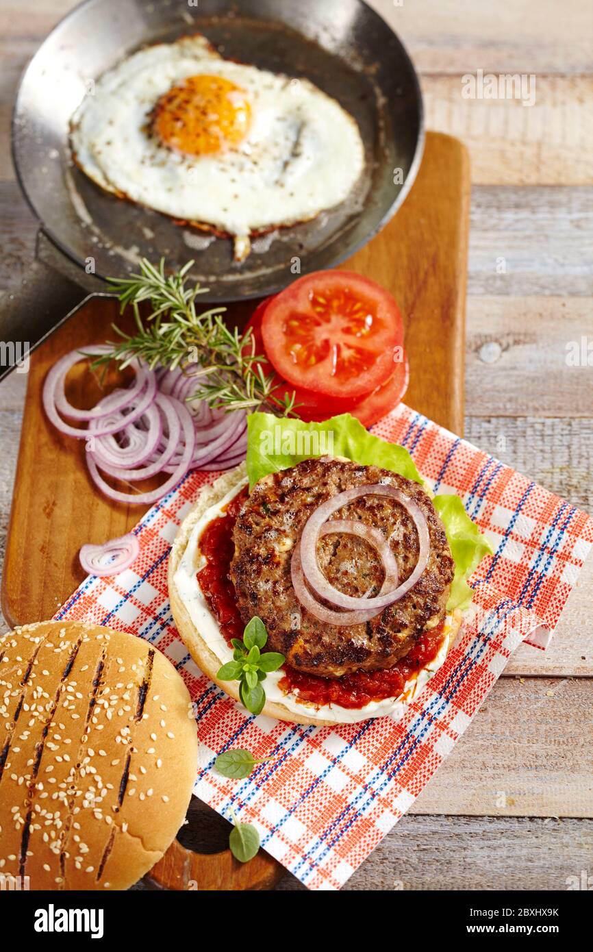 Lamb burger with egg Stock Photo Alamy