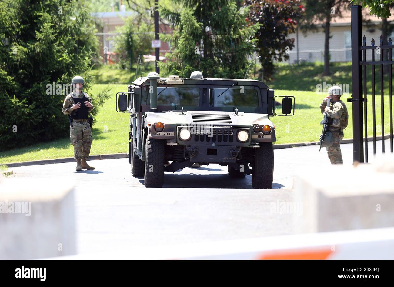 Florissant, United States. 07th June, 2020. Missouri National guardsmen stand guard at the entrance to the Florissant Police Department in Florissant, Missouri on June 7, 2020. The guard has been called in to protect the property after a video was released that shows a police SUV knocking a man to the ground. The 31-year-old driver, a nine year veteran of the department, has been suspended. The man who appeared to be running from police, was not seriously hurt. Photo by Bill Greenblatt/UPI Credit: UPI/Alamy Live News Stock Photo