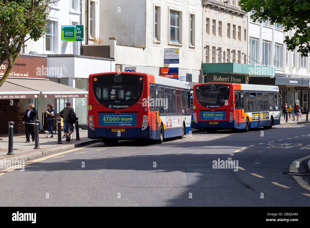 Worthing, Sussex, UK; 7th June 2020; Rear view of Two Buses Parked in a Town Centre Street Stock Photo