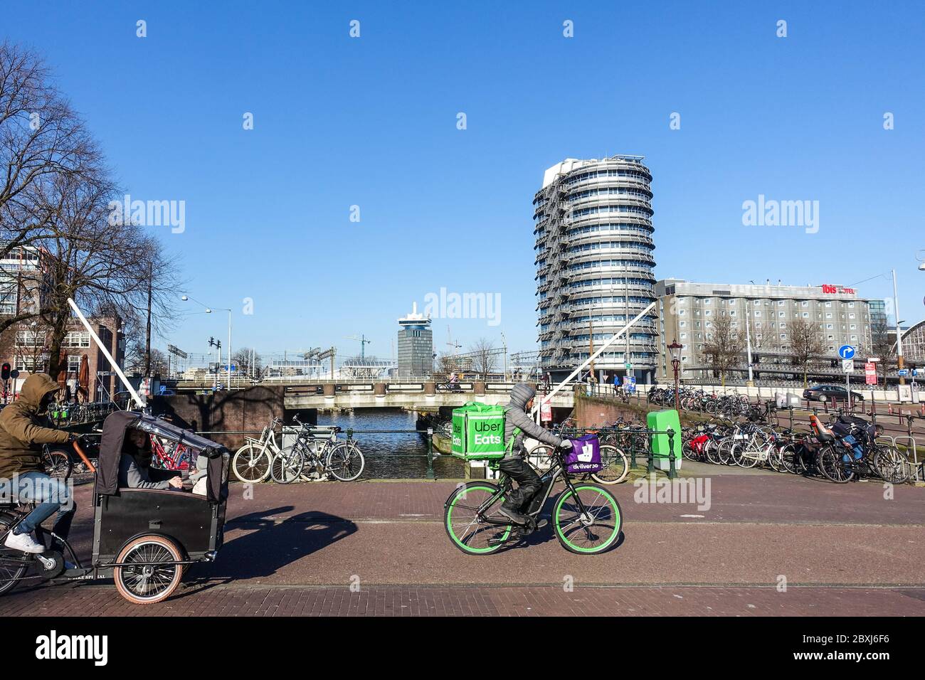 Uber Eats bicycle courier in Amsterdam during COVID-19 crisis (May 2020) Stock Photo