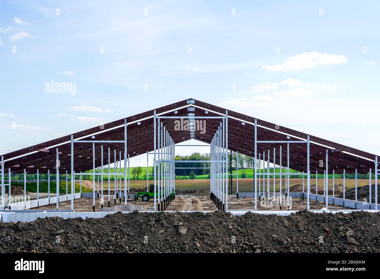 view of a new metal frame structure of an agricultural building under