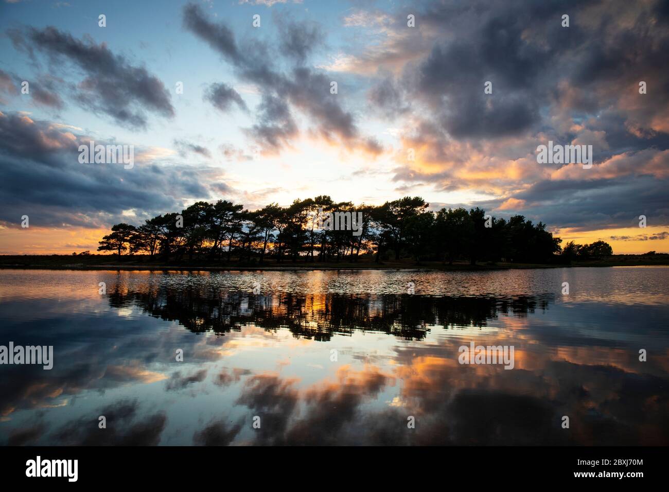 Sunset at Hatchet Pond near Beaulieu in The New Forest, Hampshire UK Stock Photo