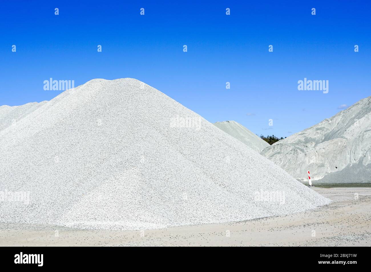 piles of bulk materials for the production of various concrete mixtures Stock Photo