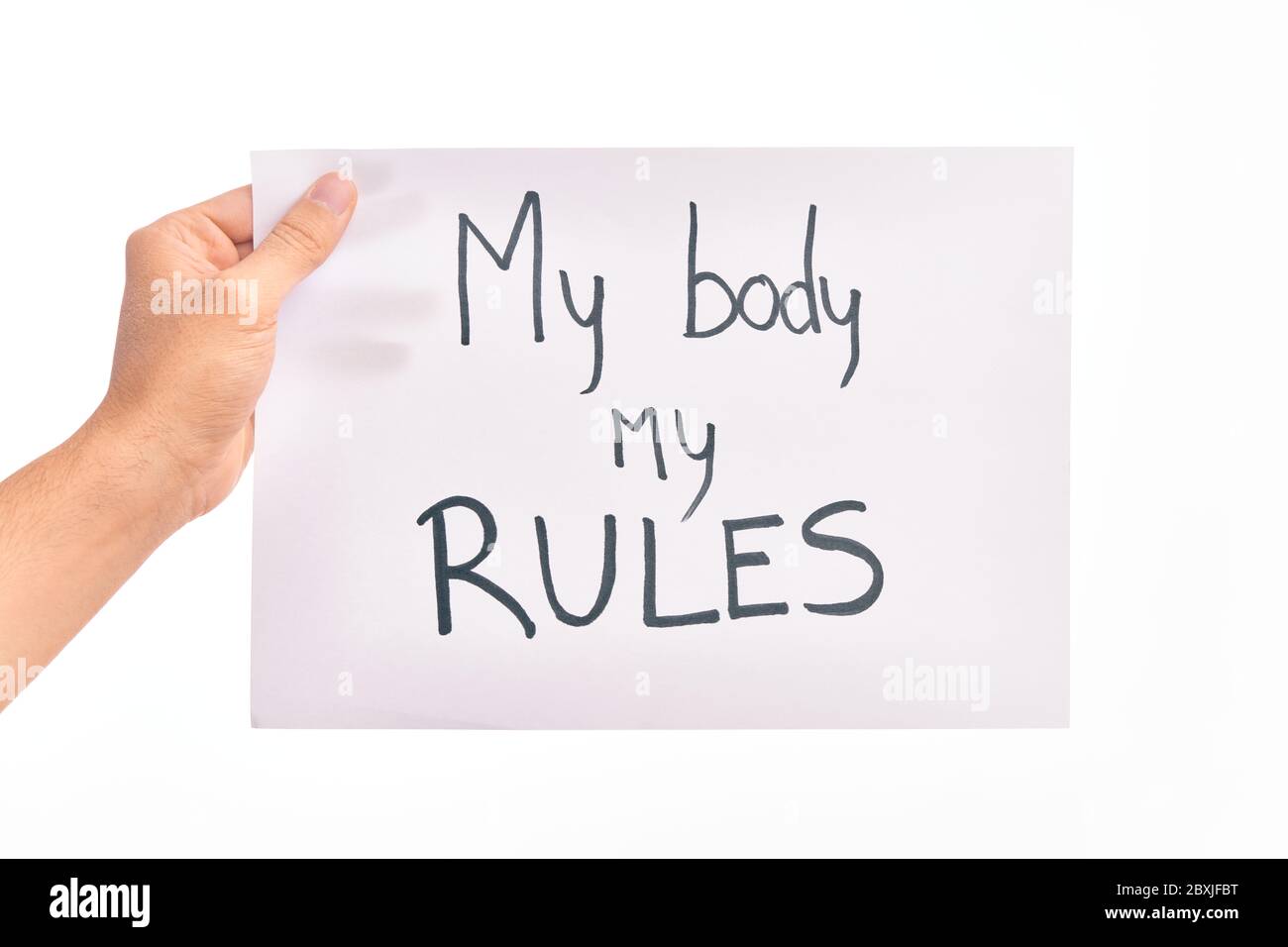 Cardboard banner with MY BODY MY RULES asking for body rights over ...