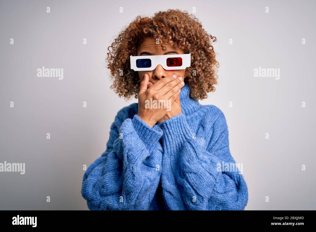 Young african american curly woman wearing 3d glasses over isolated ...