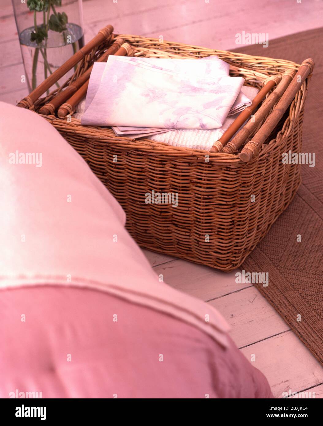 Wicker baskets used for storage under the bed Stock Photo Alamy