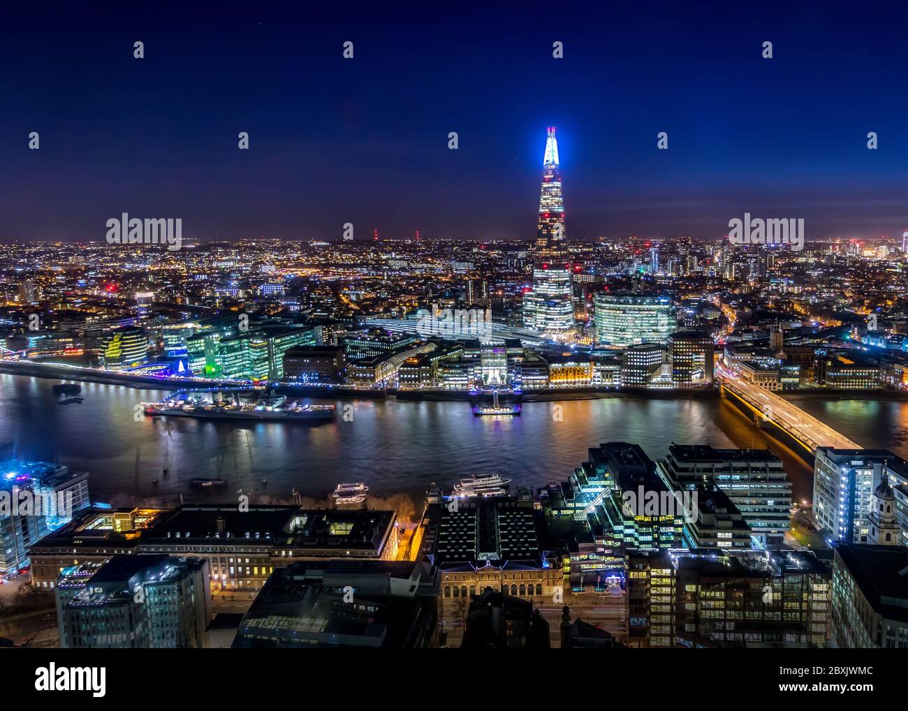 Aerial View of London City Skyline and the Thames River from the Rooftop at Night, UK Stock Photo