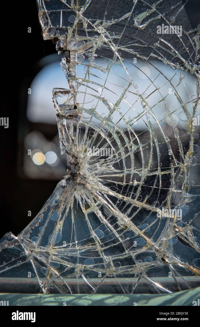 Broken safety glass in an old car window in a junk yard Stock Photo Alamy