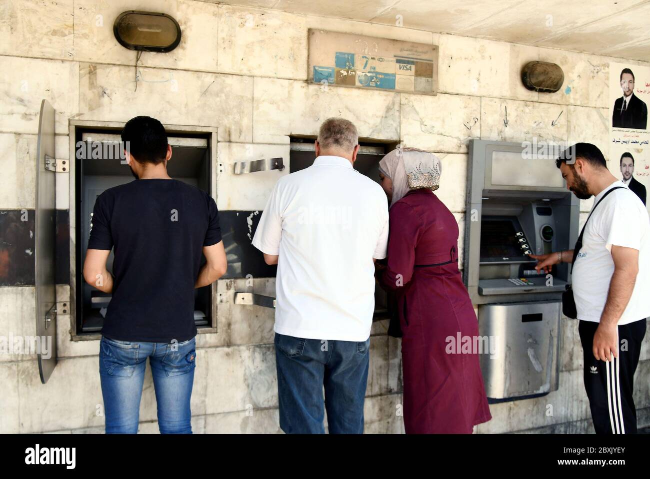 Damascus, Syria. 7th June, 2020. Syrians use ATMs in Damascus, capital of Syria, on June 7, 2020. Syrians have been complaining about the skyrocketing prices amid a tough economic situation. Credit: Ammar Safarjalani/Xinhua/Alamy Live News Stock Photo