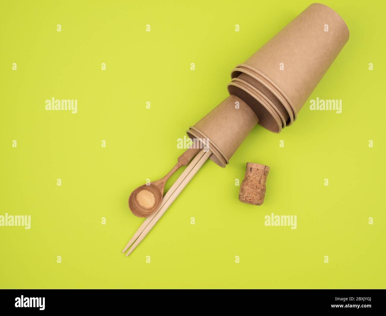 Kitchen accessories from ecological materials on a green background. Stock Photo