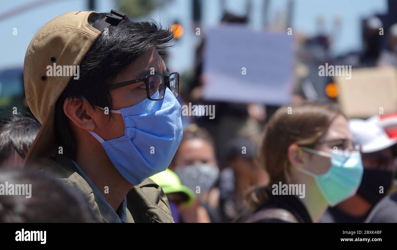 Oceanside, CA / USA - June 7, 2020: Close up of a protester listening at a peaceful Black Lives Matter protest rally Stock Photo