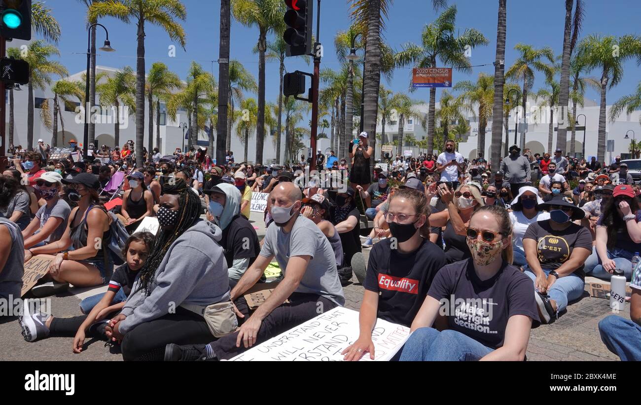Oceanside, CA / USA - June 7, 2020: Large peaceful crowd of protesters listening at a Black Lives Matter protest rally, one of many in San Diego area. Stock Photo
