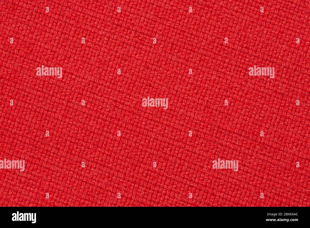 red wool fabric texture, diagonally arranged upholstery cloth background Stock Photo
