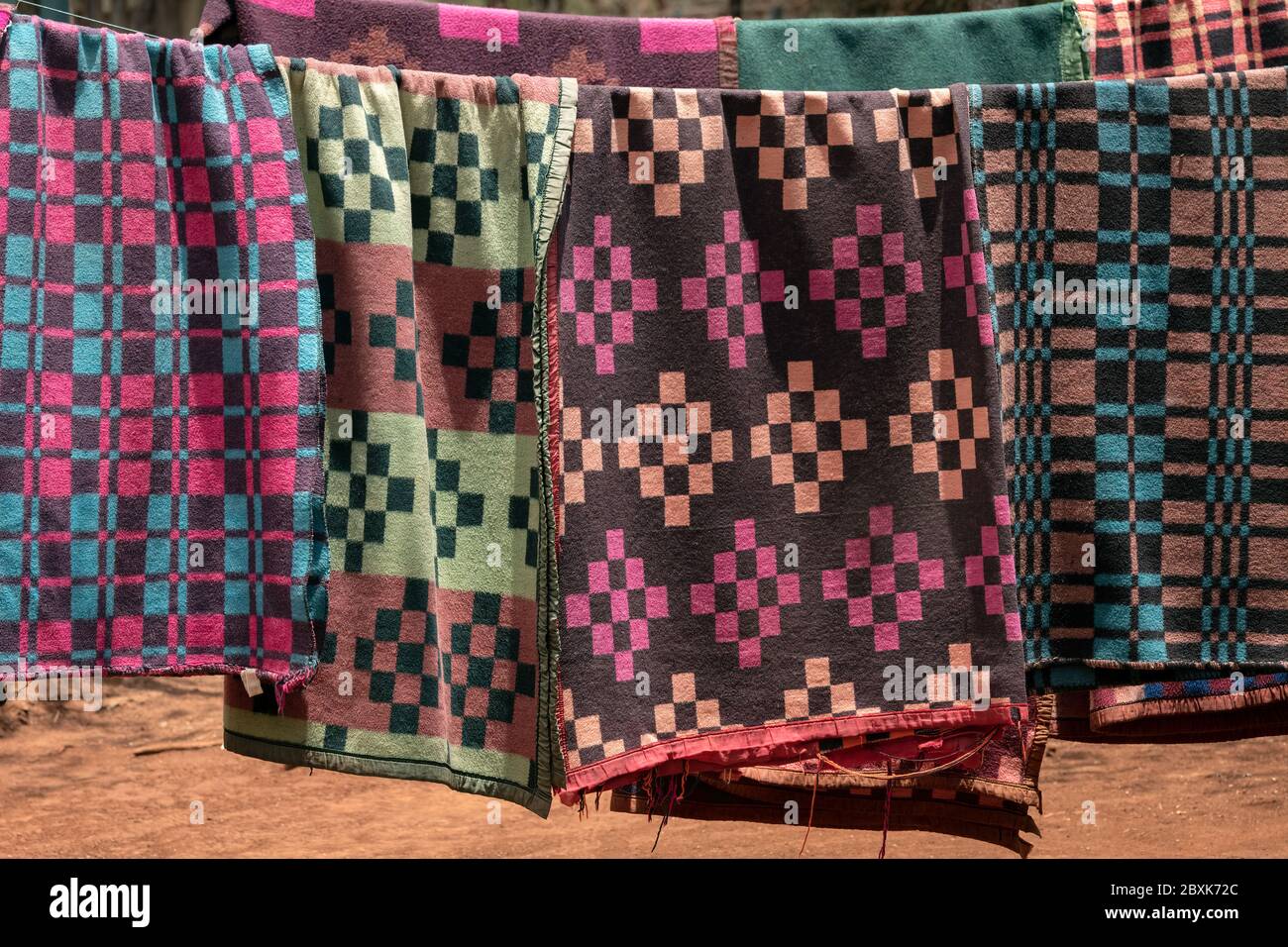 Colorful blankets hanging on a line to dry. Image taken in Nairobi