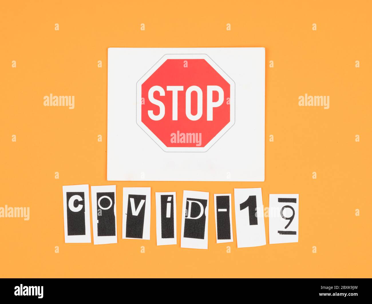 covid-19-and-a-stop-sign-on-orange-background-stock-photo-alamy