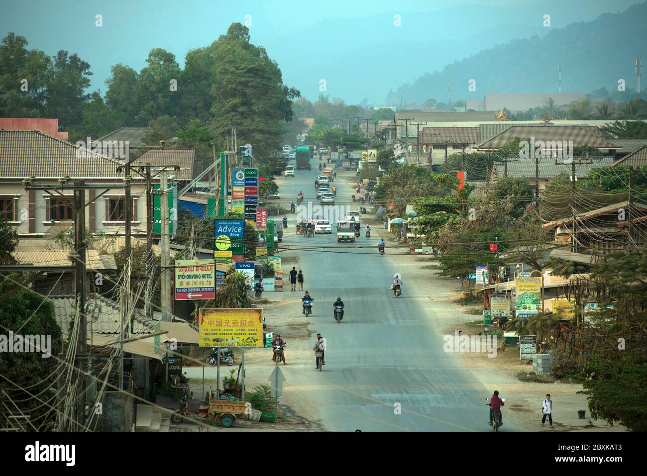 A street scene looking north from the centre of Vang Vieng, Laos, Southeast Asia. Stock Photo