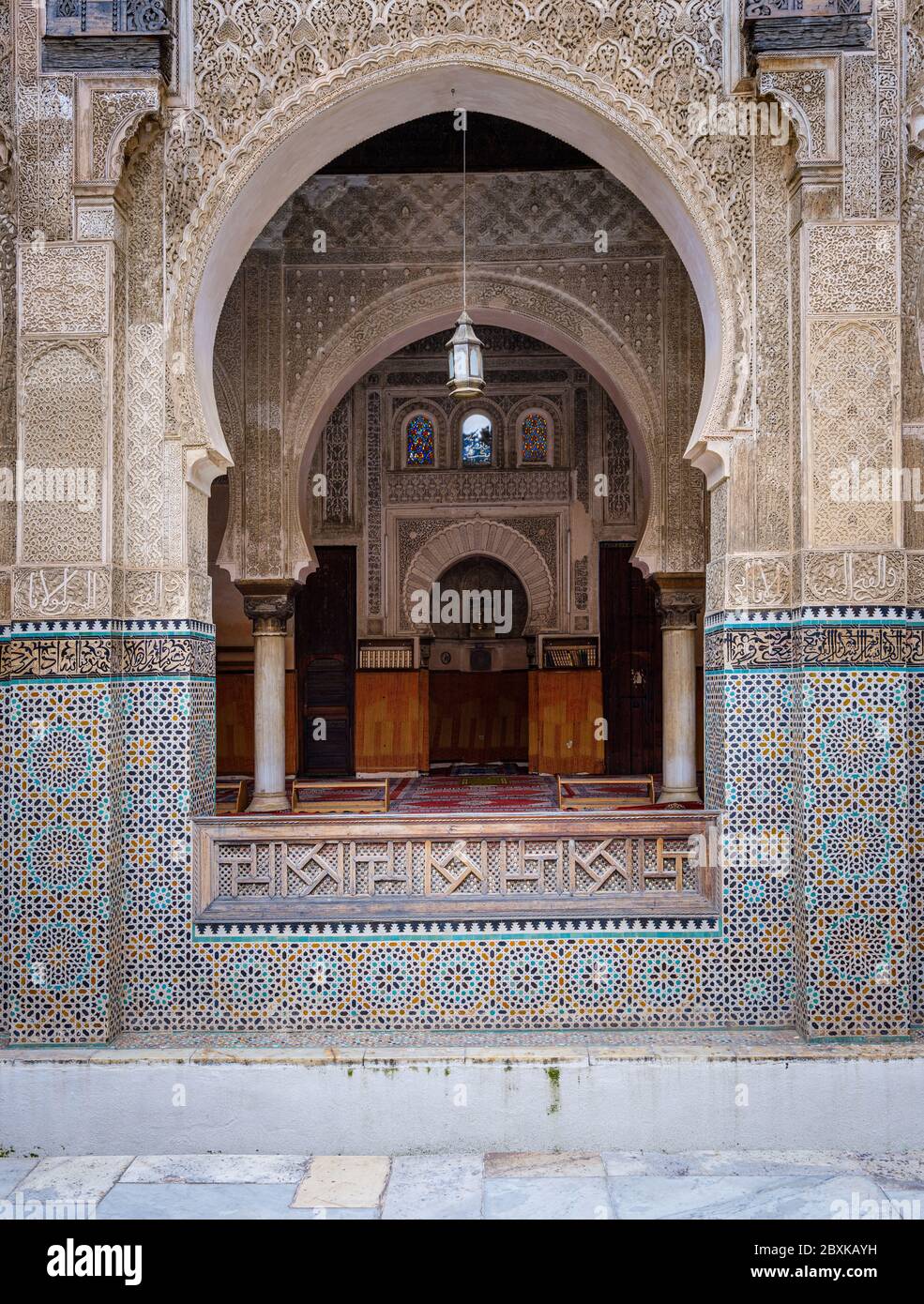 FEZ, MOROCCO - CIRCA MAY 2018:  Courtyard of the Al-Attarine Madrasa in Fez. The courtyard of this small Marinid madrasa is a dazzling example of intr Stock Photo